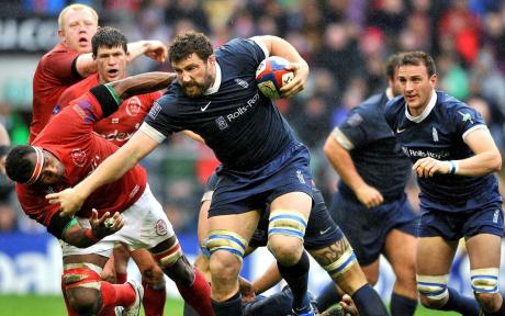 Action shot from an army and navy rugby match.